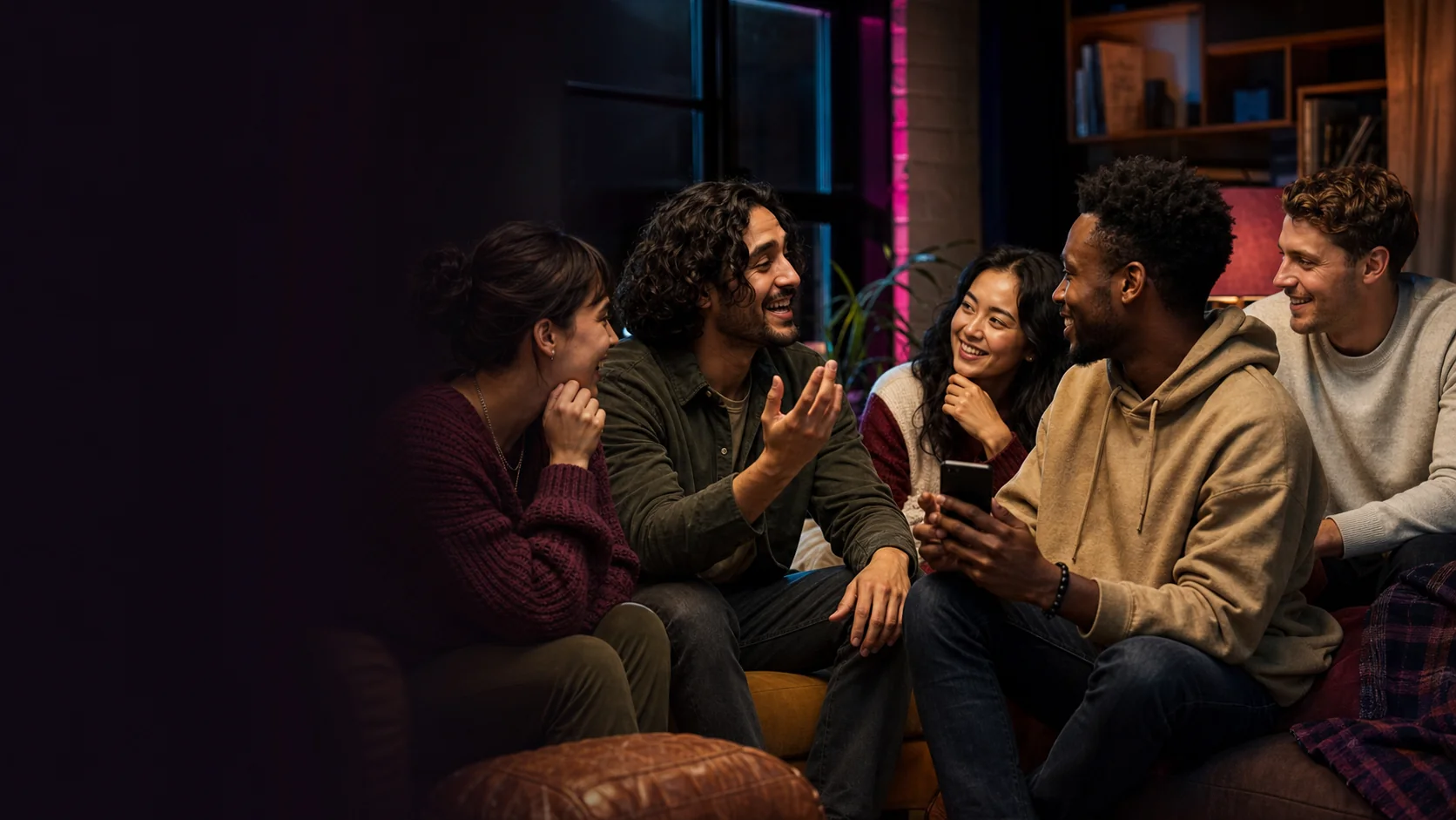 Five new friends leaning into a lively conversation around one phone